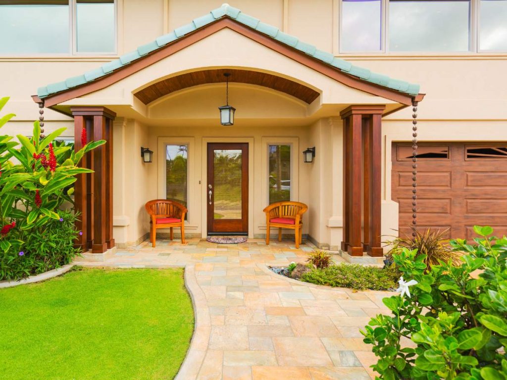 A beautifully remodeled home exterior showcasing high-ROI improvements like new siding, windows, and landscaping