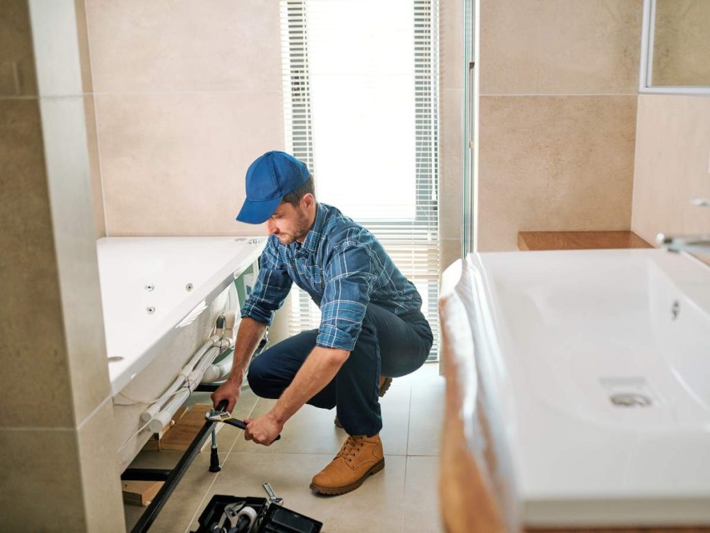A modern bathroom under renovation, featuring a well-planned layout with new fixtures and updated design elements.
